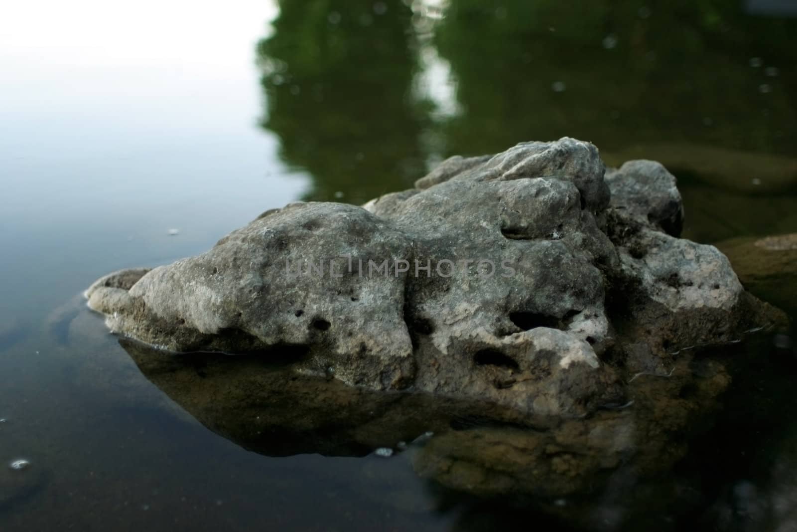 Simple rock poking out of the lake