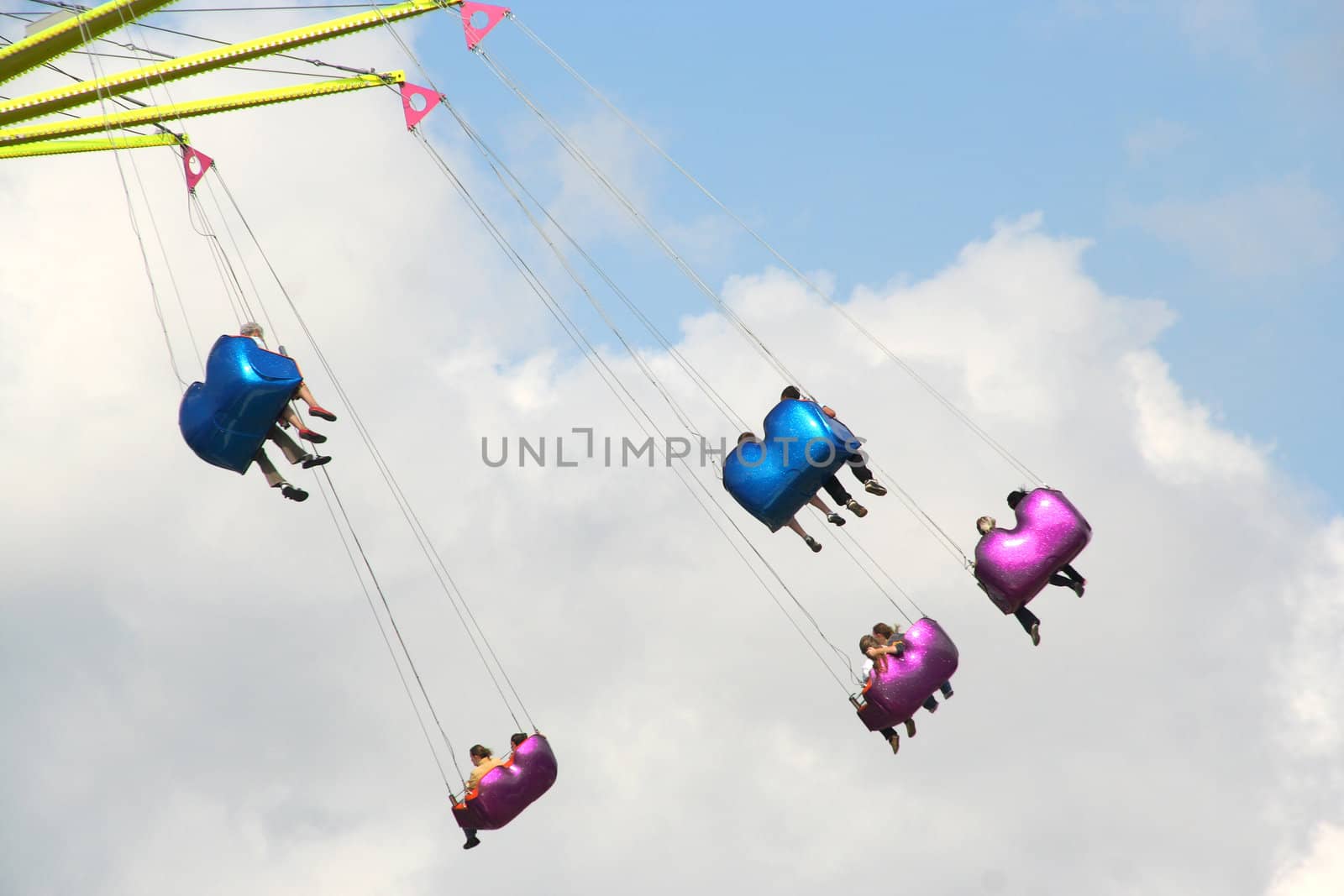 Cars of a high carousel at a fun fair