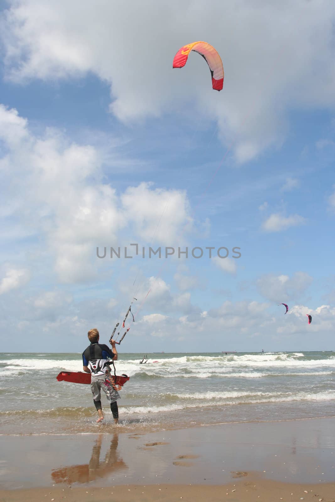 Kite surfer about to enter the surf