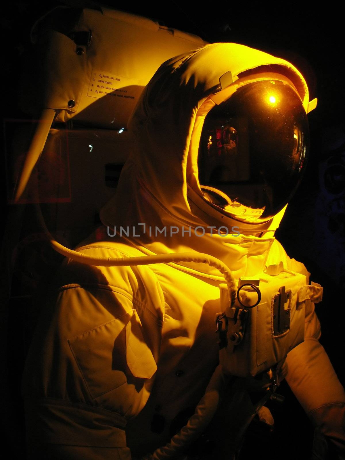 A complete astronaut setup under dramatic lighting.  