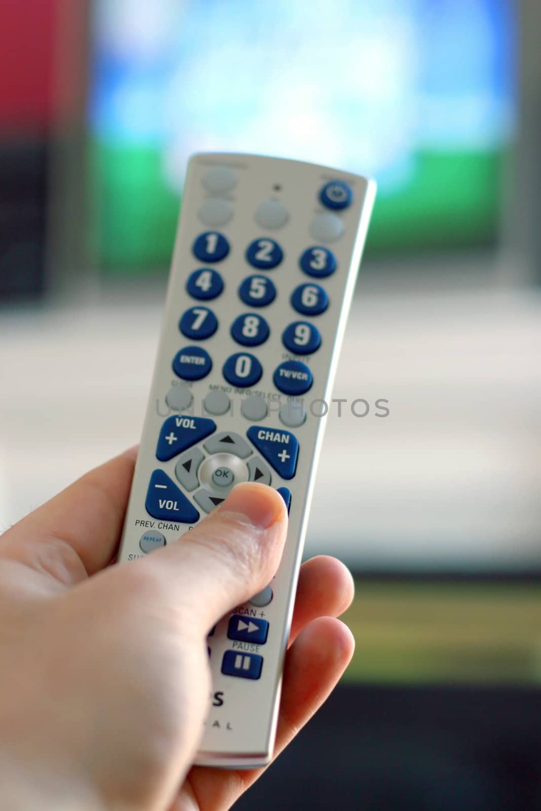 A remote control in action - shallow depth of field, with focus on the remote.