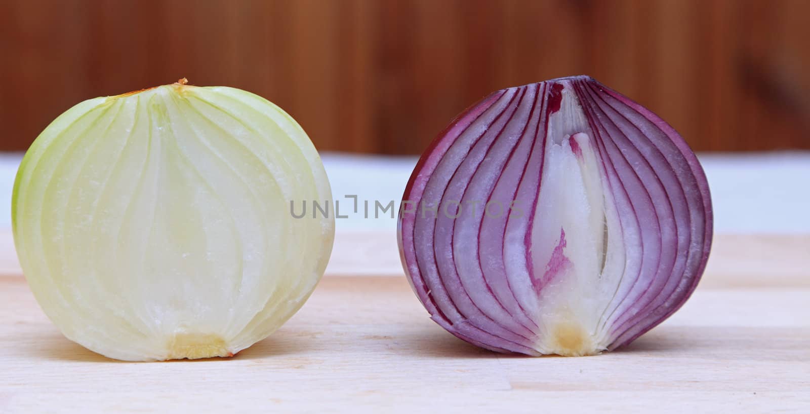Image of two different halves of onions on a kitchen table.