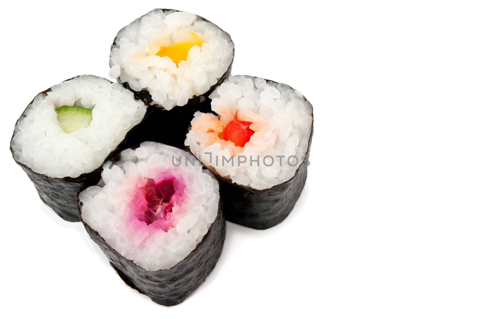 Close up of four maki rolls arranged over white