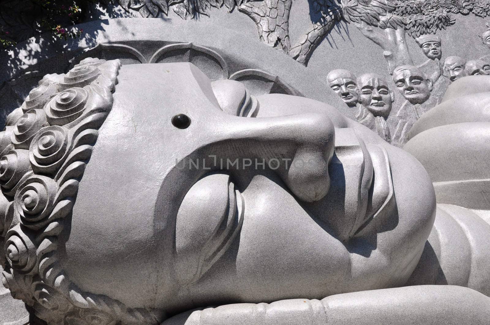 Closeup view of a historic lying buddha statue