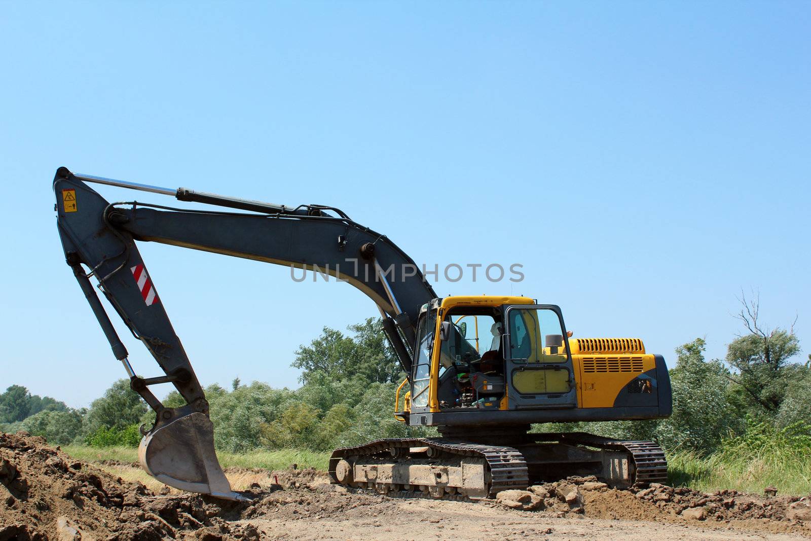 construction site with excavator by goce