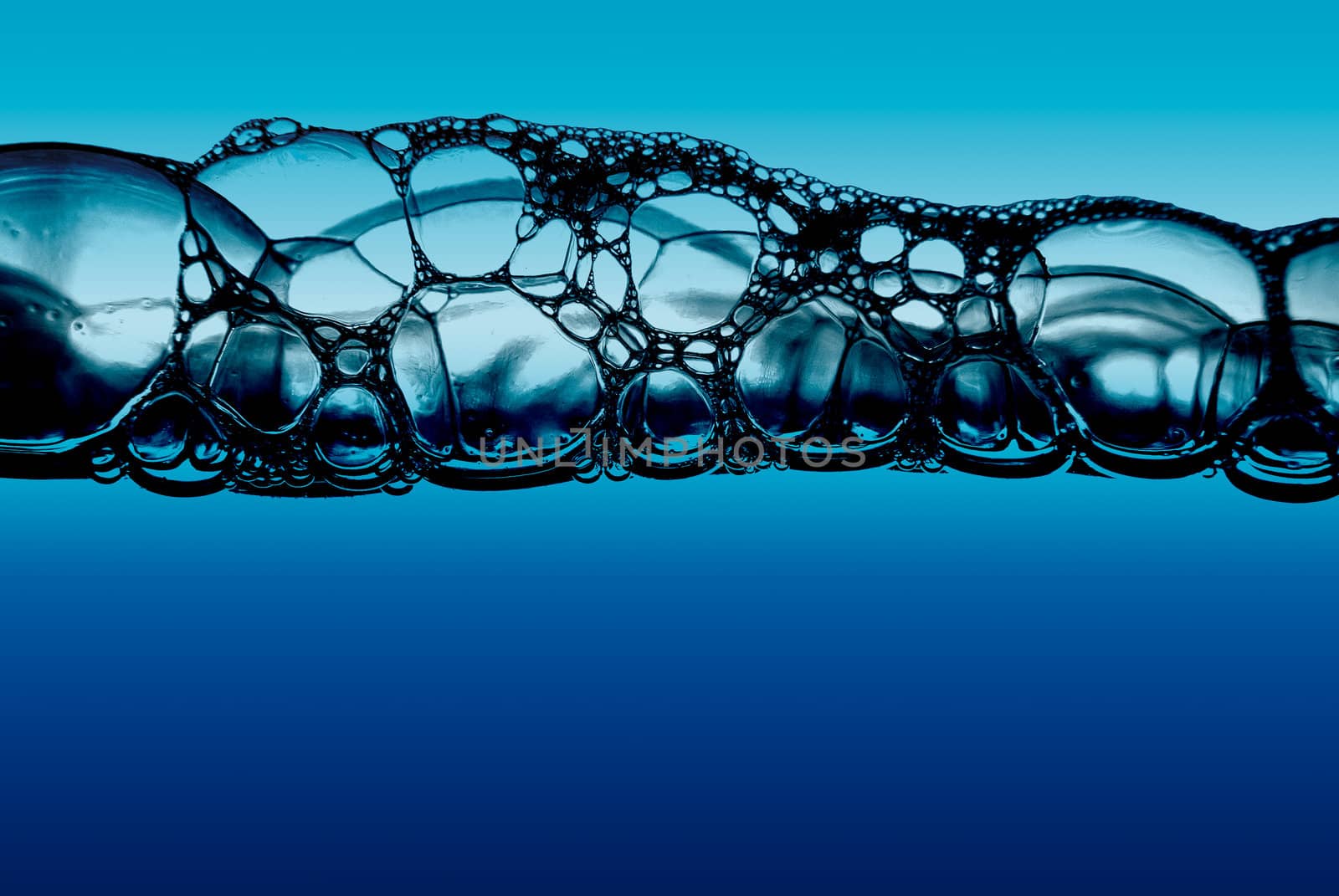 Water with bubbles on blue background.