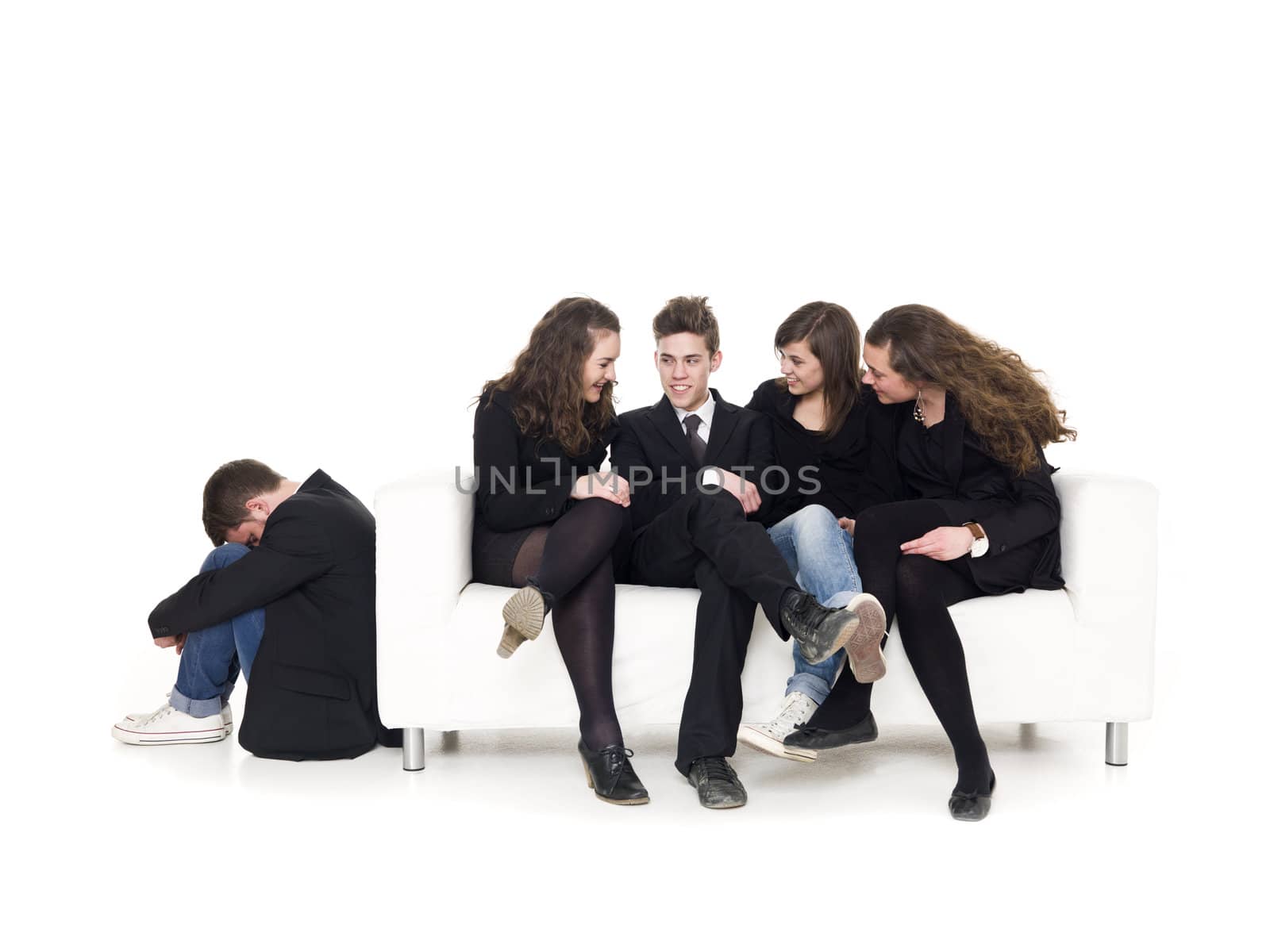 Four people in a sofa rejecting a guy isolated on white background