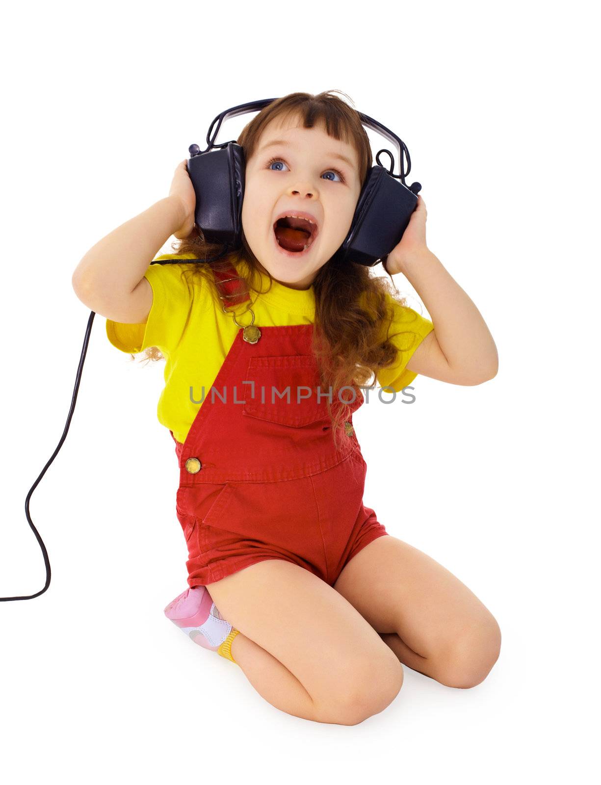 Cheerful little girl loudly sings the music isolated on white background