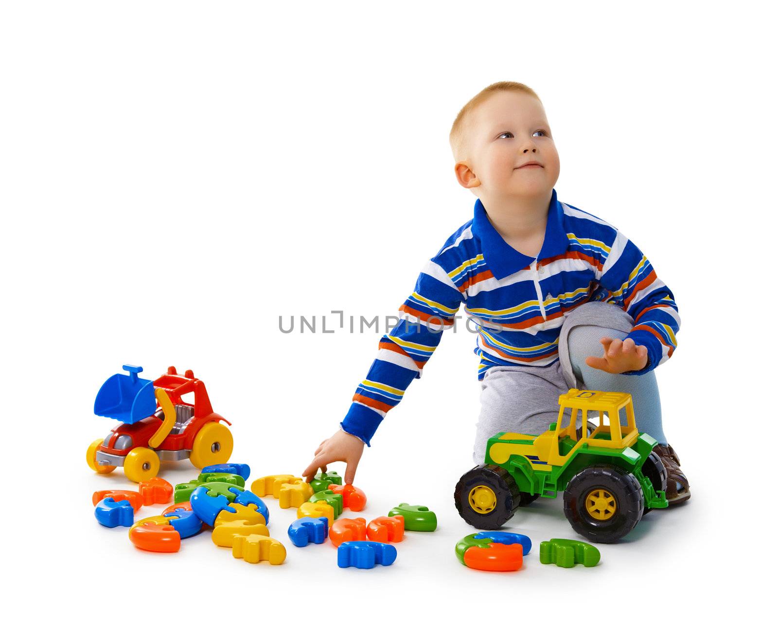 Little boy playing with toys on the floor