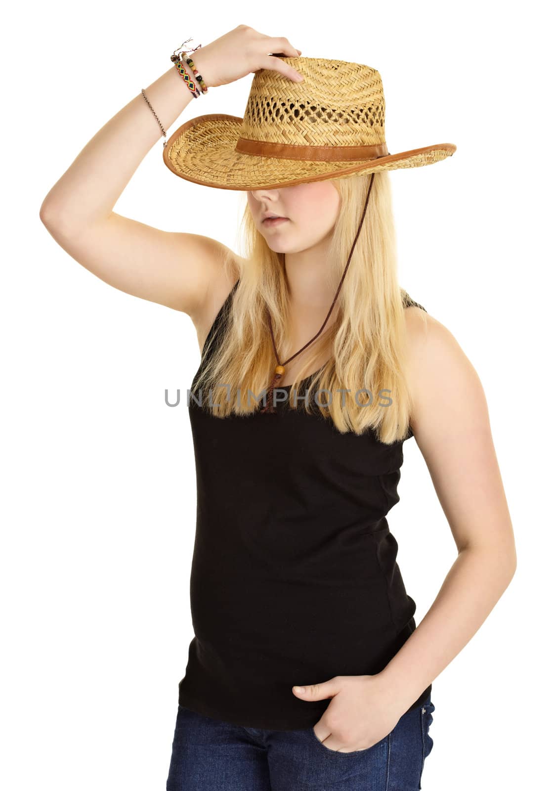 Young pale girl in old-fashioned straw hat isolated on white