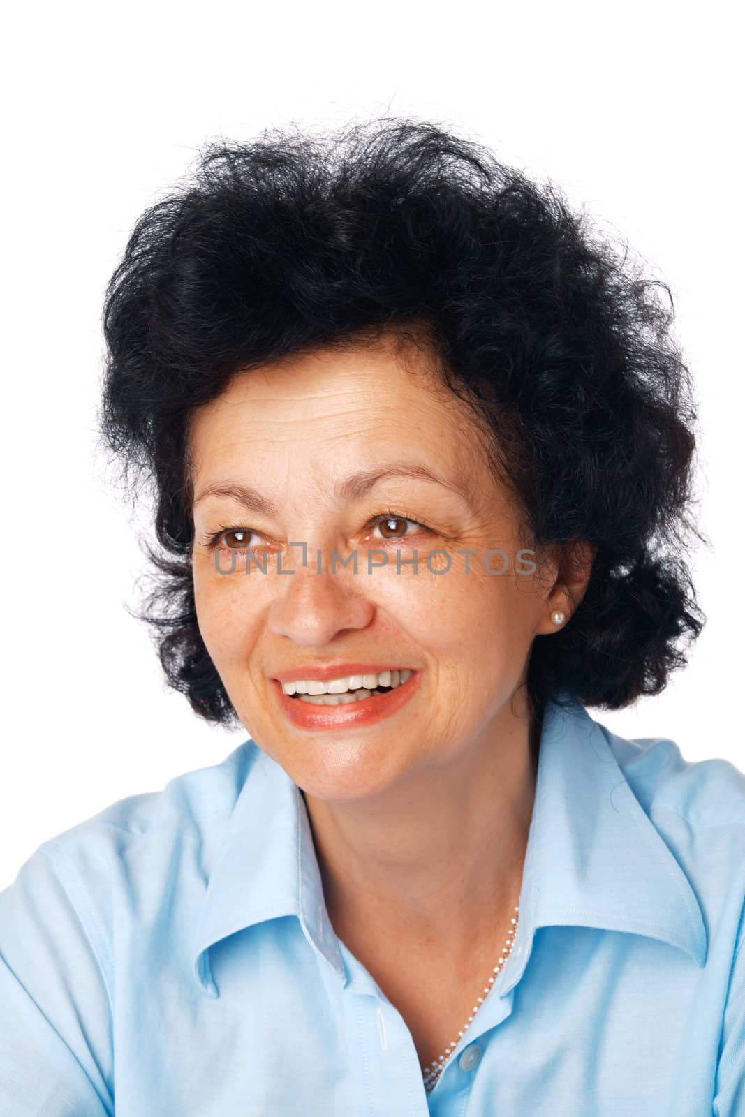 Closeup portrait of a  senior female smiling and looking away on white background. 
