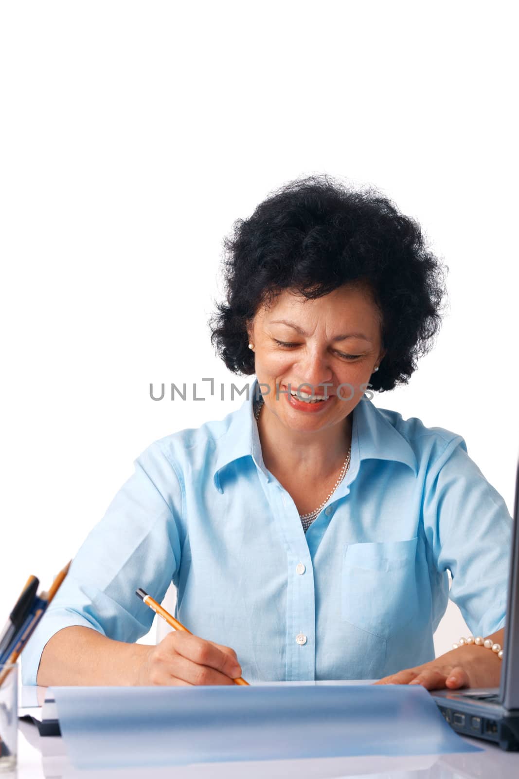 Elder woman writing something with a pencil