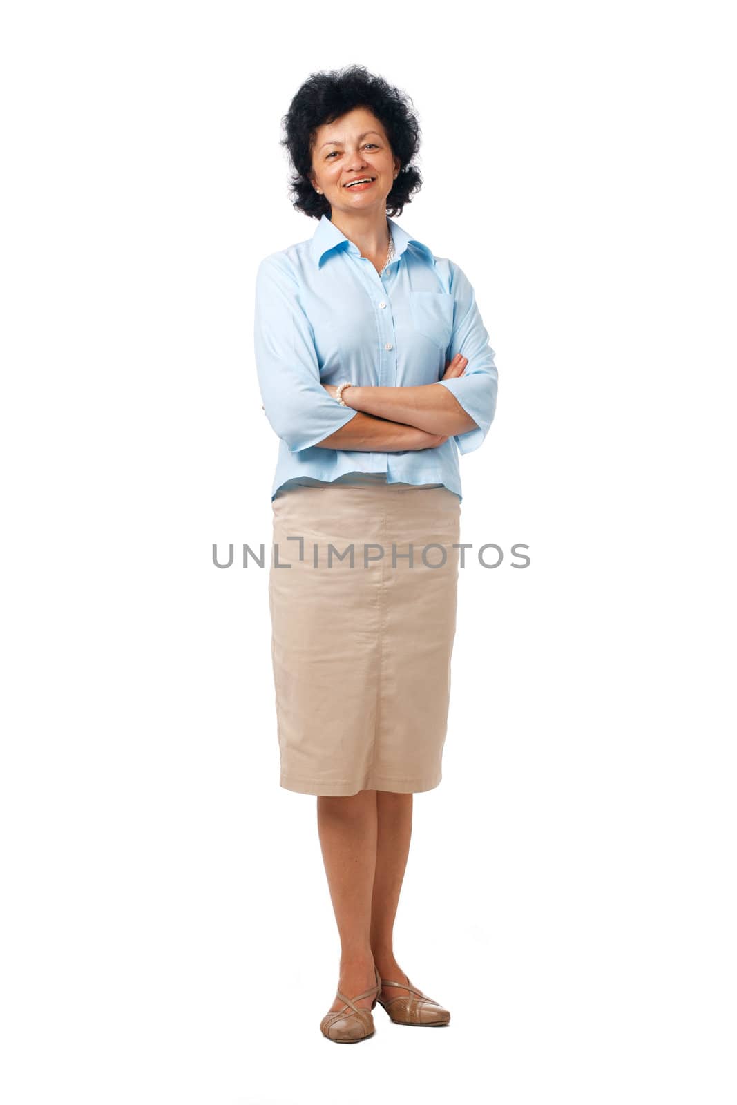 Full length portrait of an elderly woman standing with folded hands.