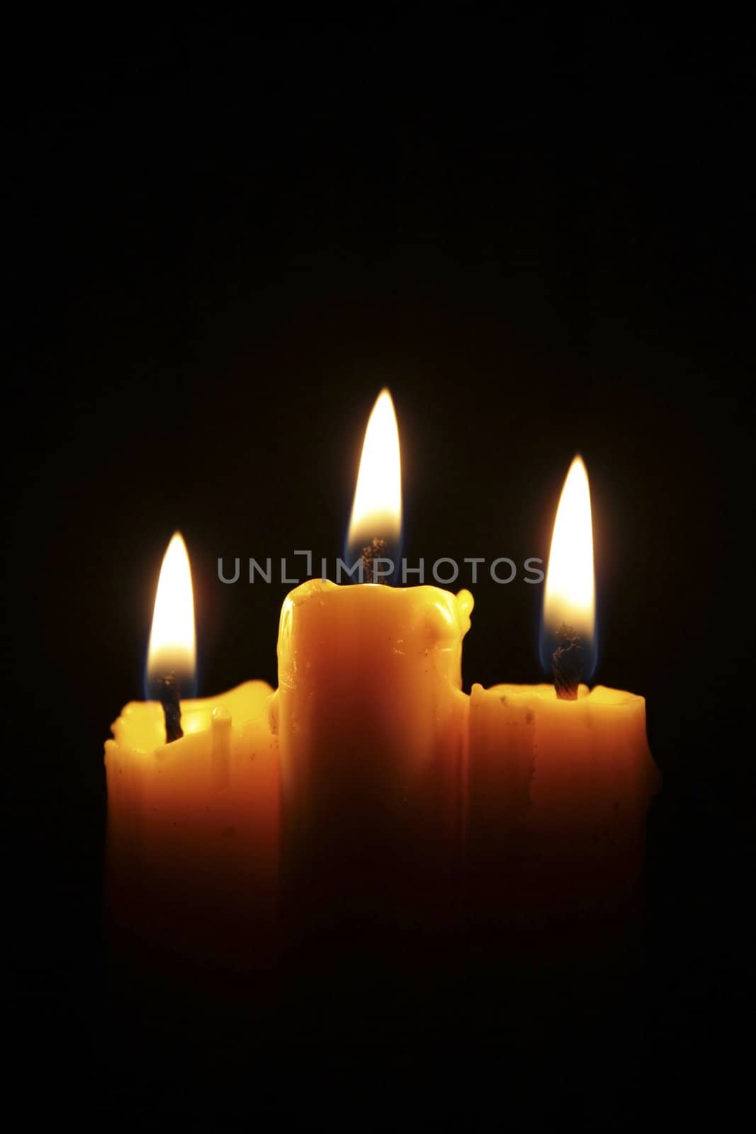 Three burning candles