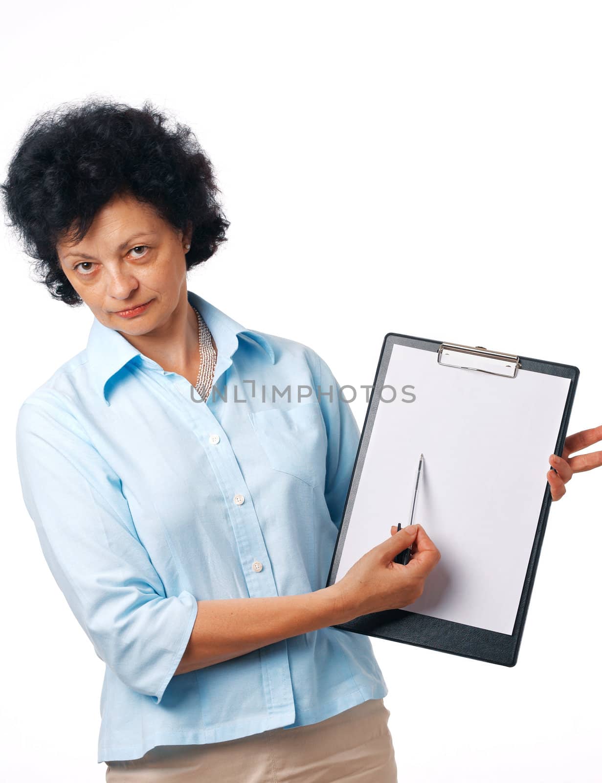 Serious elder woman holding a clipboard and showing something over white.