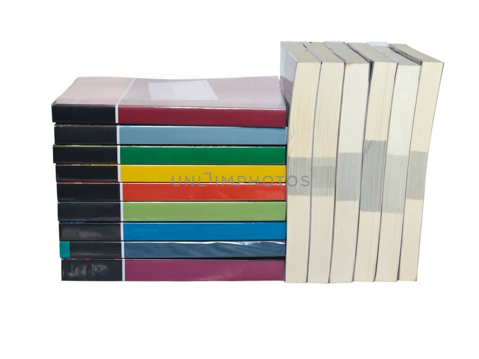 Isolated stacks of colorful real books on white background