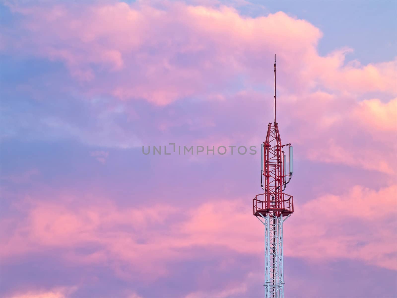 Cellular tower with twilight sky on background