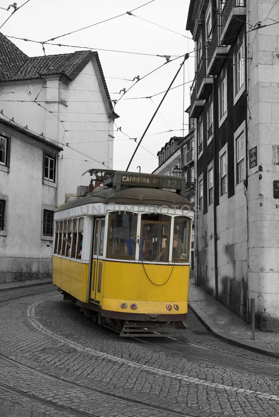 Classic yellow tram in Lisbon. by angelsimon