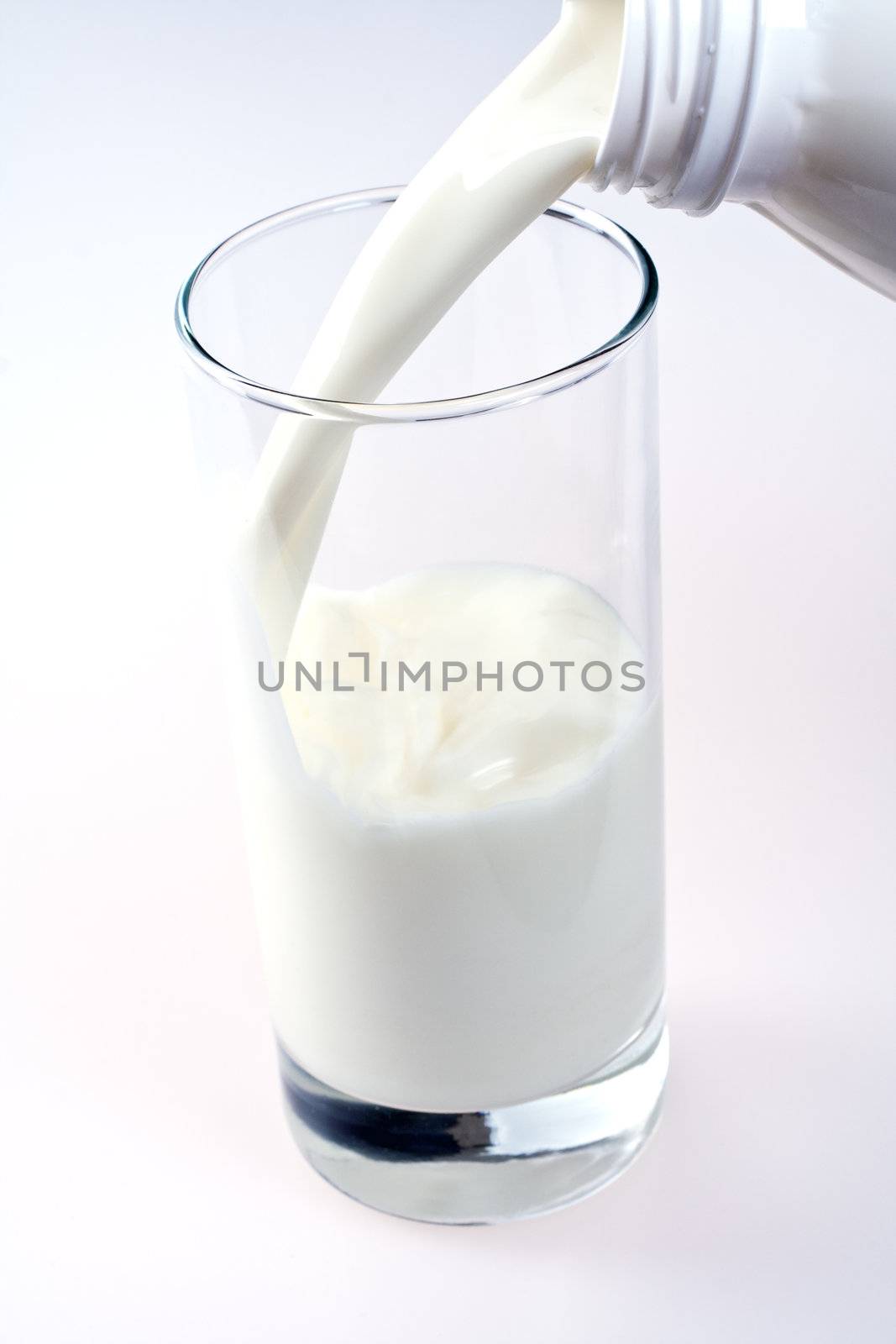 glass of milk with a bottle