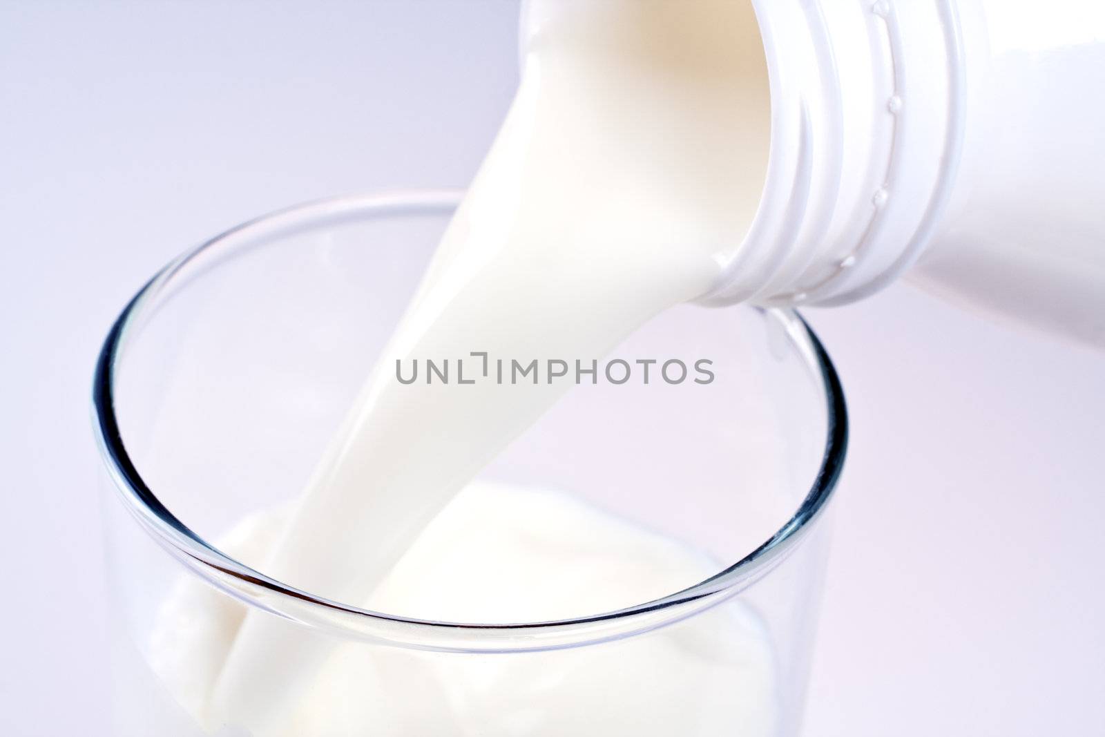 glass of milk with a bottle