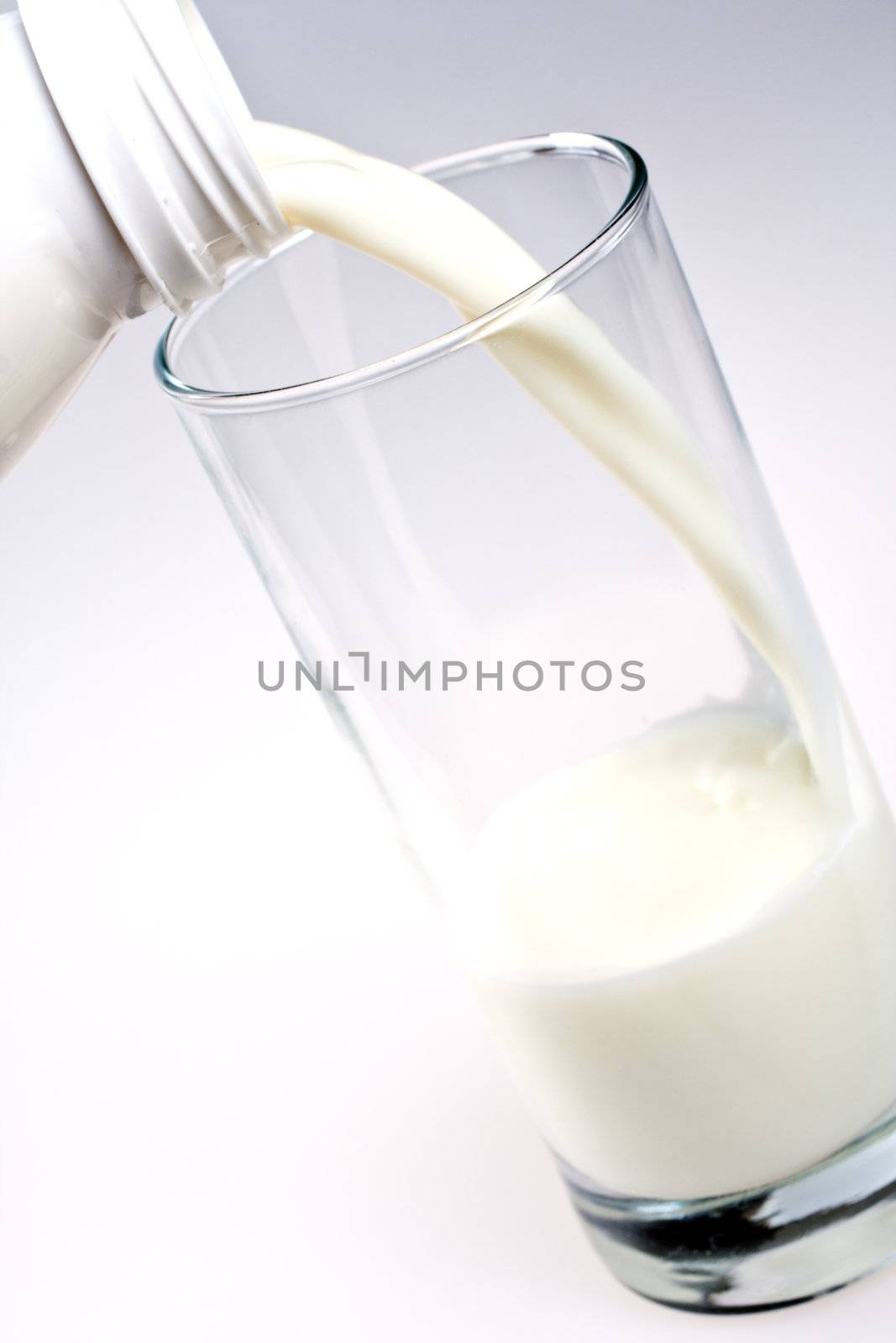 glass of milk with a bottle