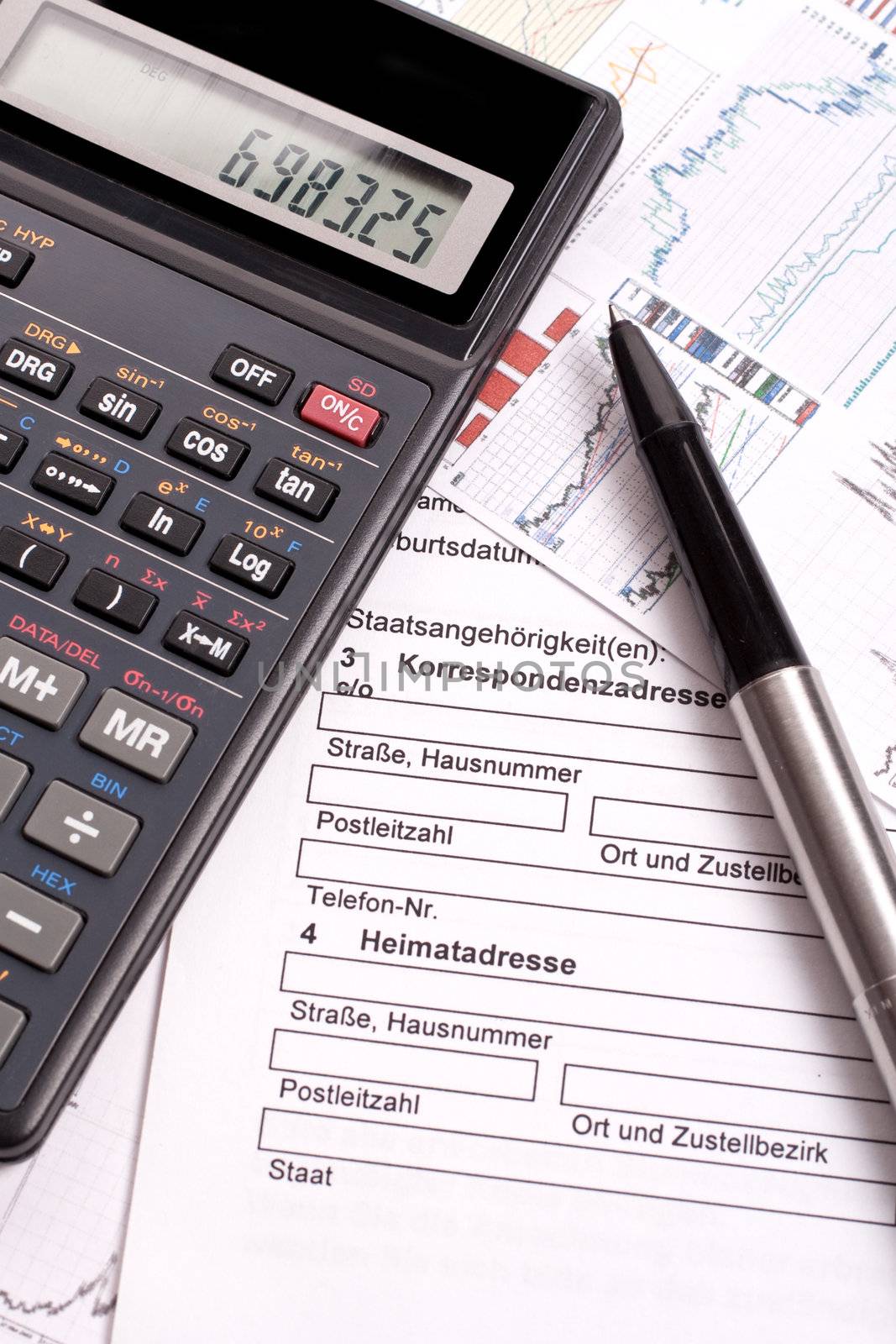 financial statement with calculator and pen