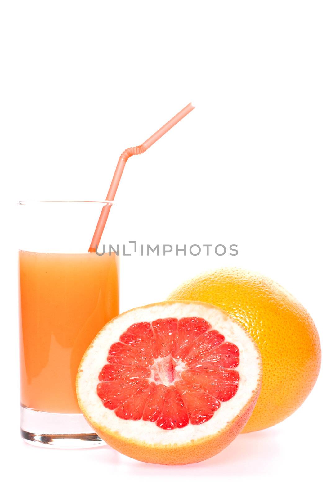 grapefruit and juice in glass on a white background