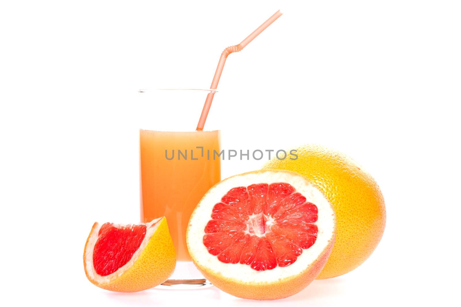 grapefruit and juice in glass on a white background