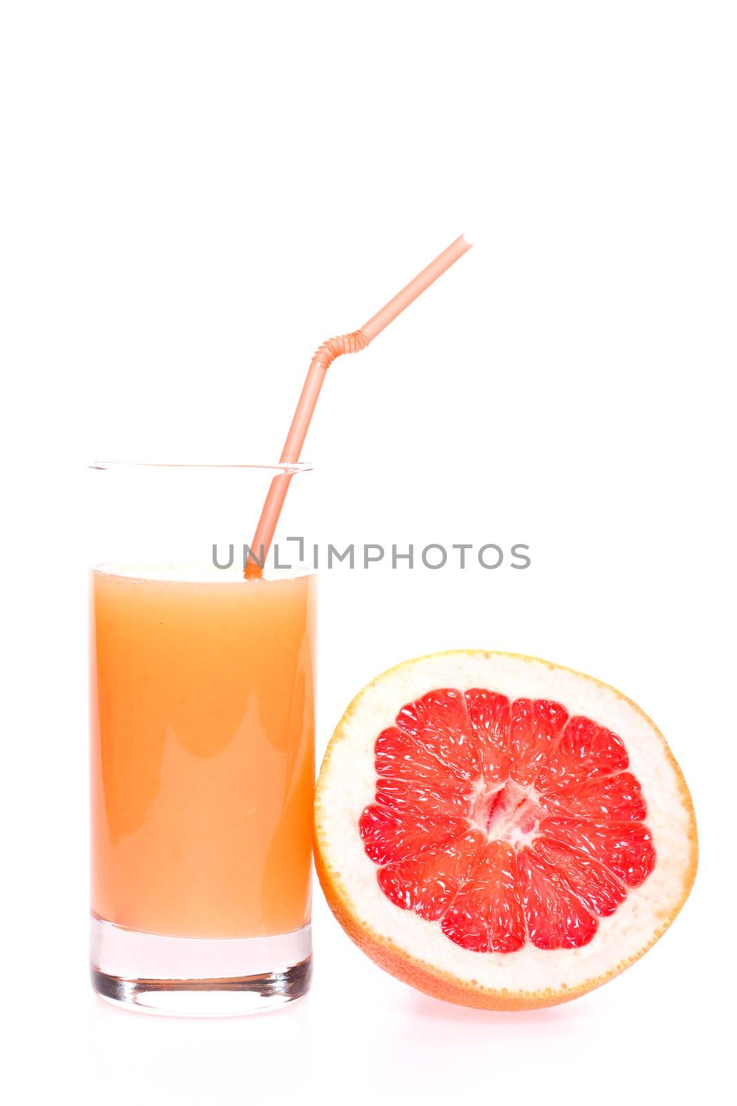 grapefruit and juice in glass on a white background