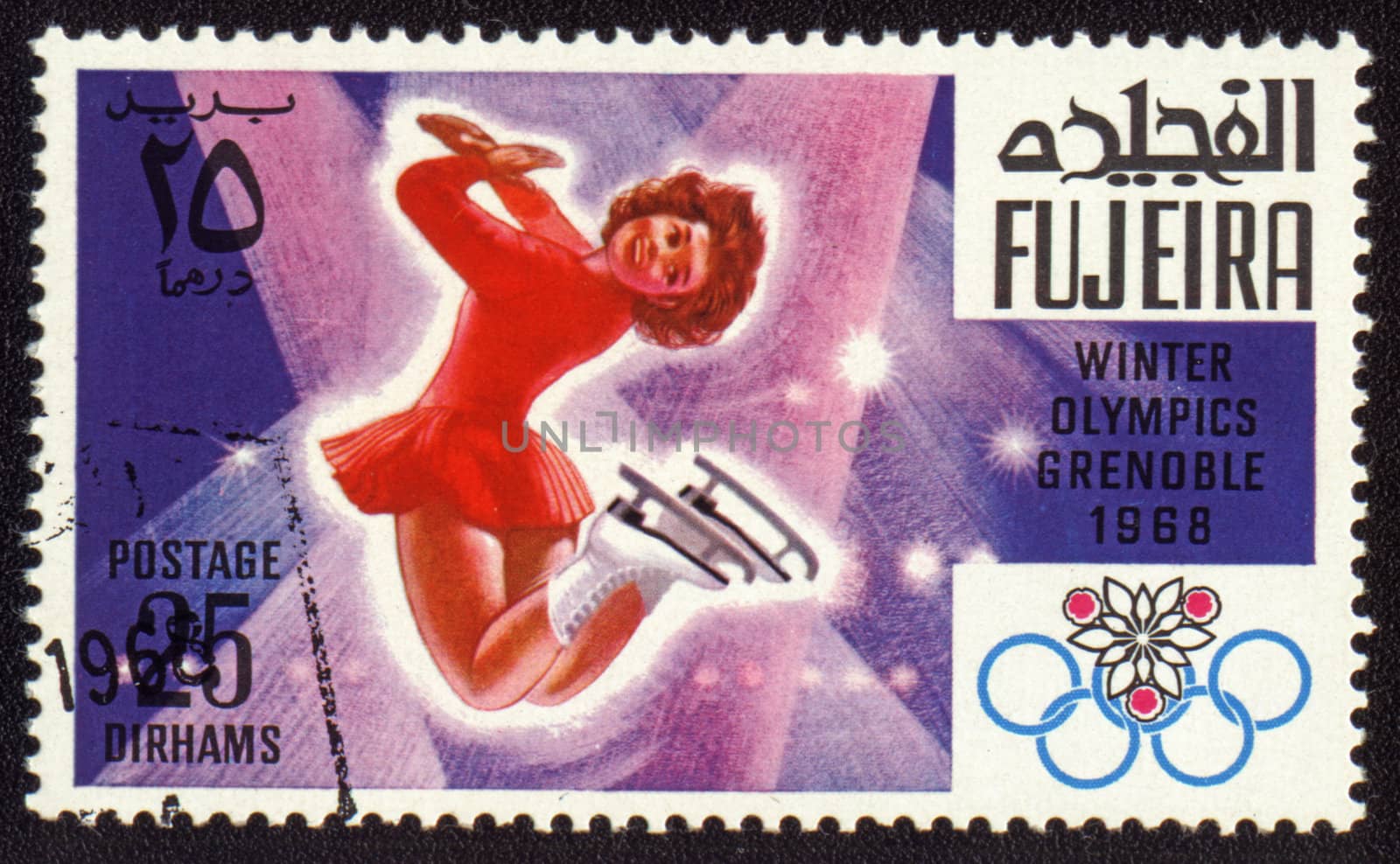 Postage stamp from Fujeira shows Winter Olympic Games in Grenoble 1968. Figure skating