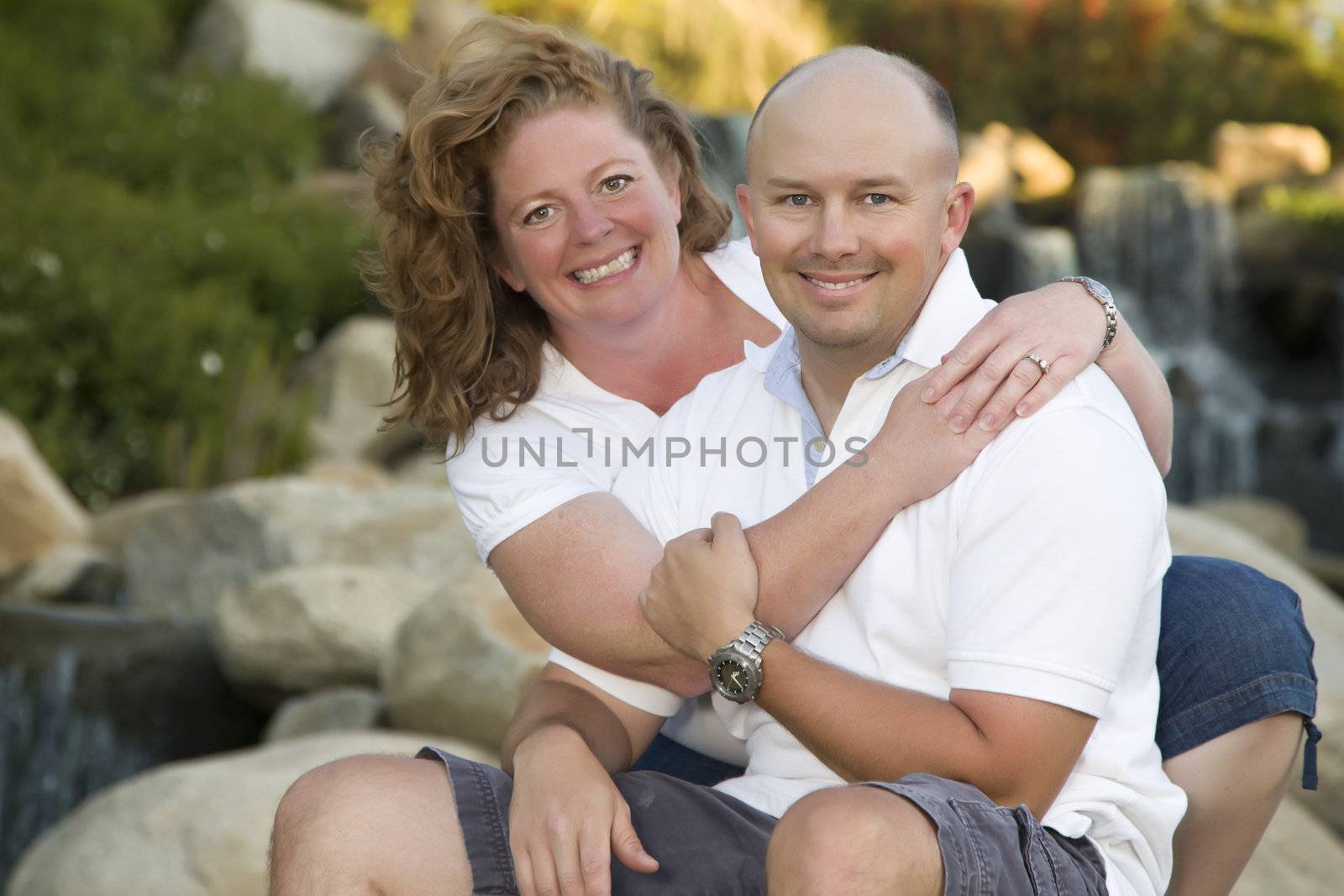 Attractive Couple Pose for Portrait in the Park.