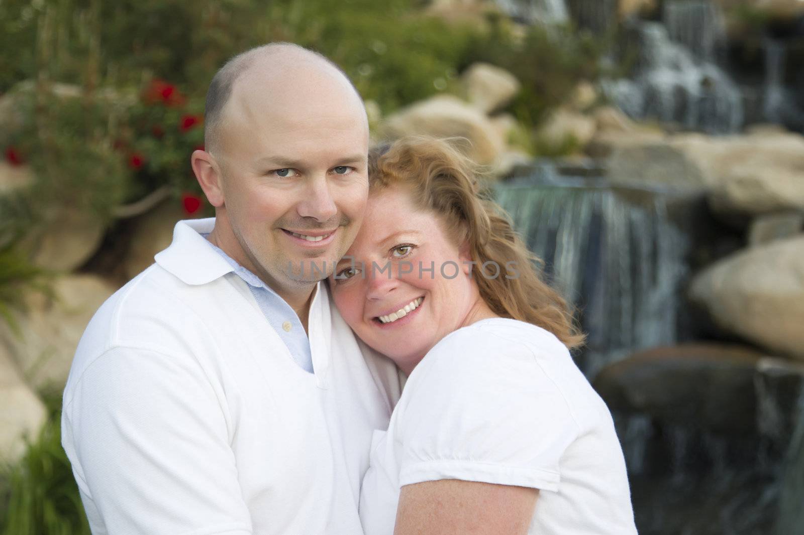 Attractive Couple Pose for Portrait in the Park.