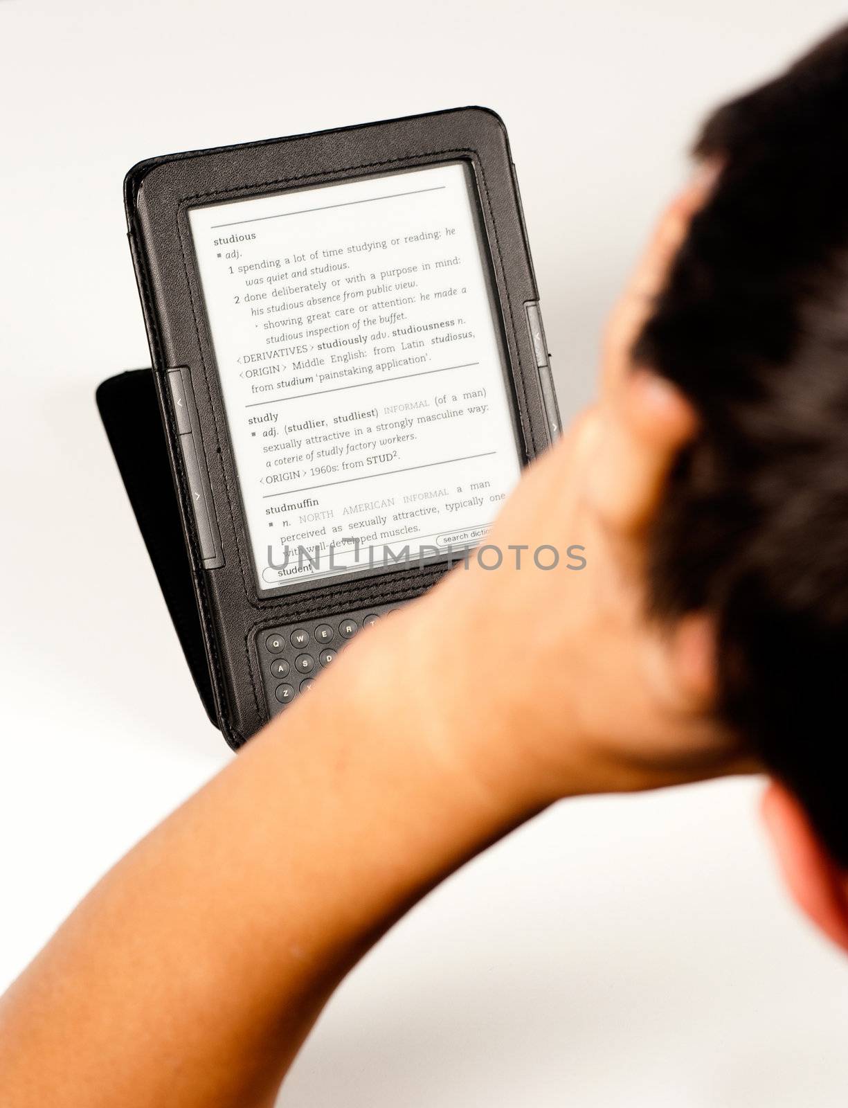 Teenage student in full concentration using an e-book