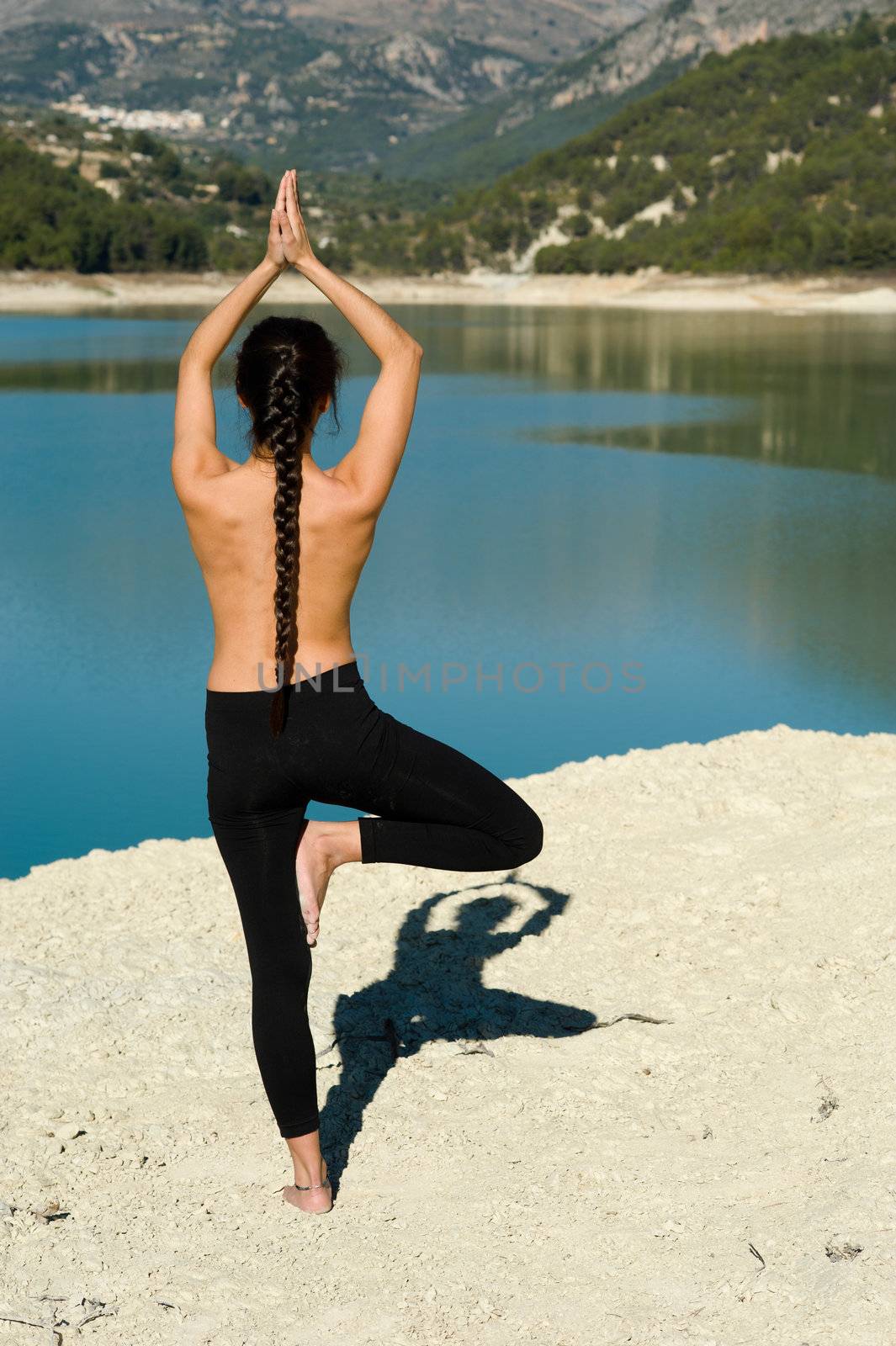 Early morning yoga at a scenic lakeside setting