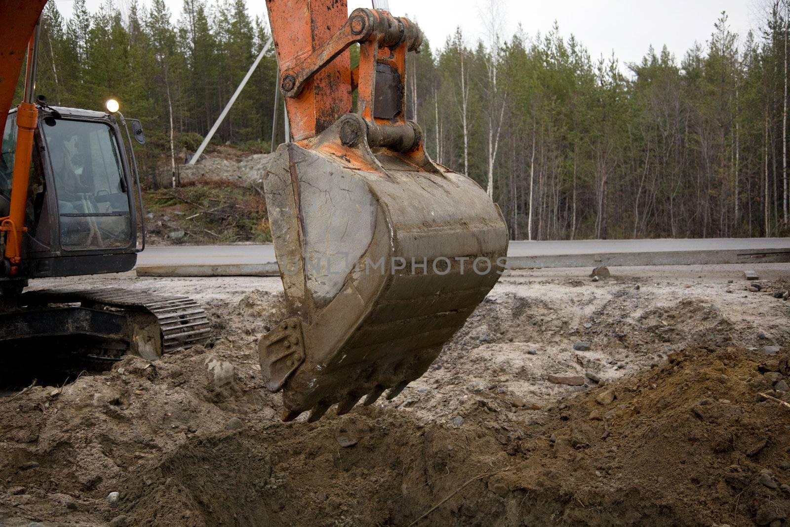 Crawler excavator working on the roadside