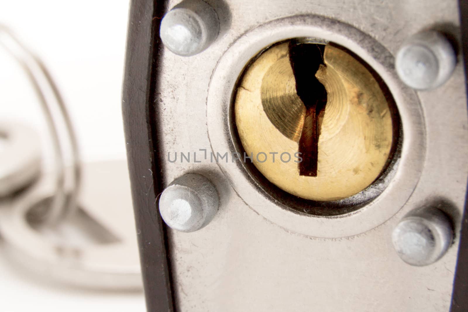 Closeup shot looking at a pin tumbler lock of a padlock