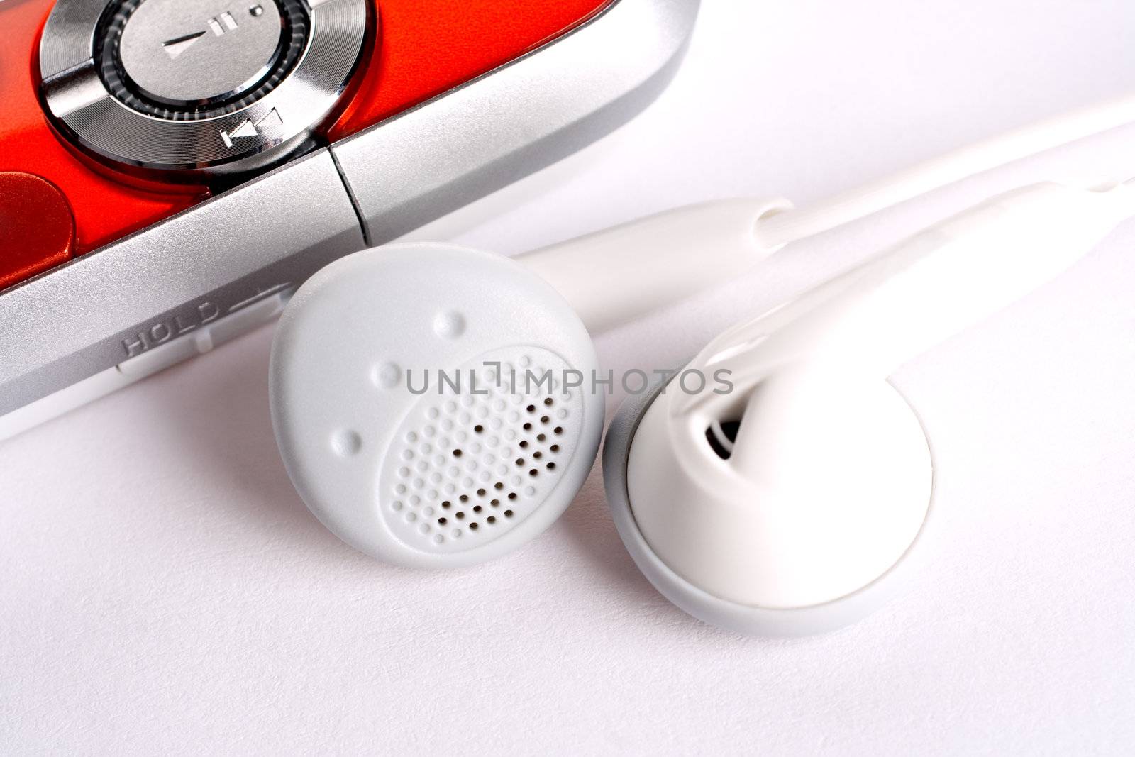 mp3 player with headphoneson on a white background