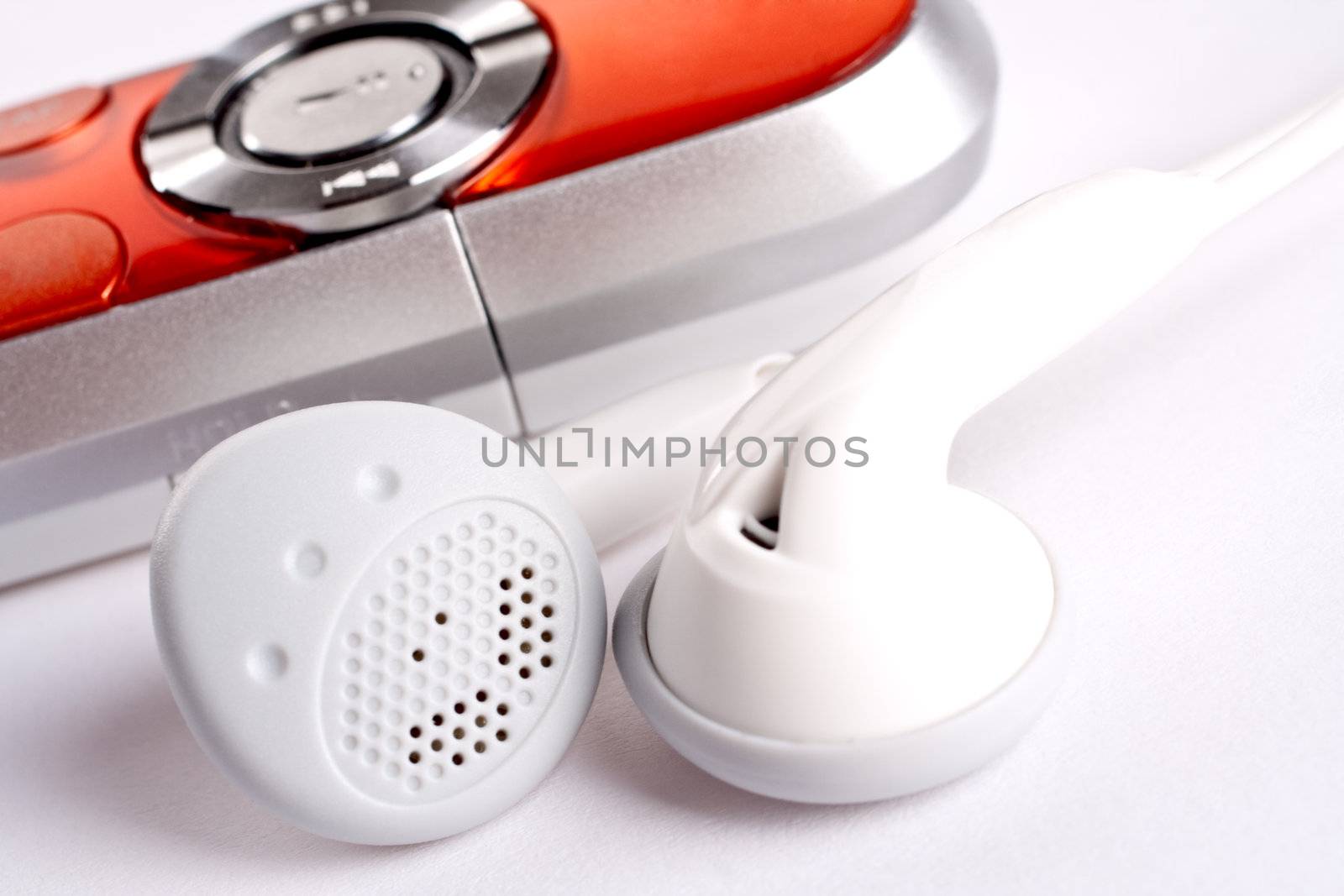 mp3 player with headphoneson on a white background