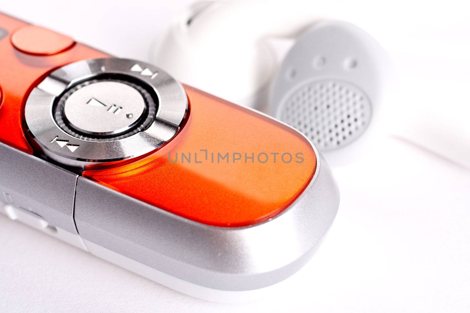 mp3 player with headphoneson on a white background