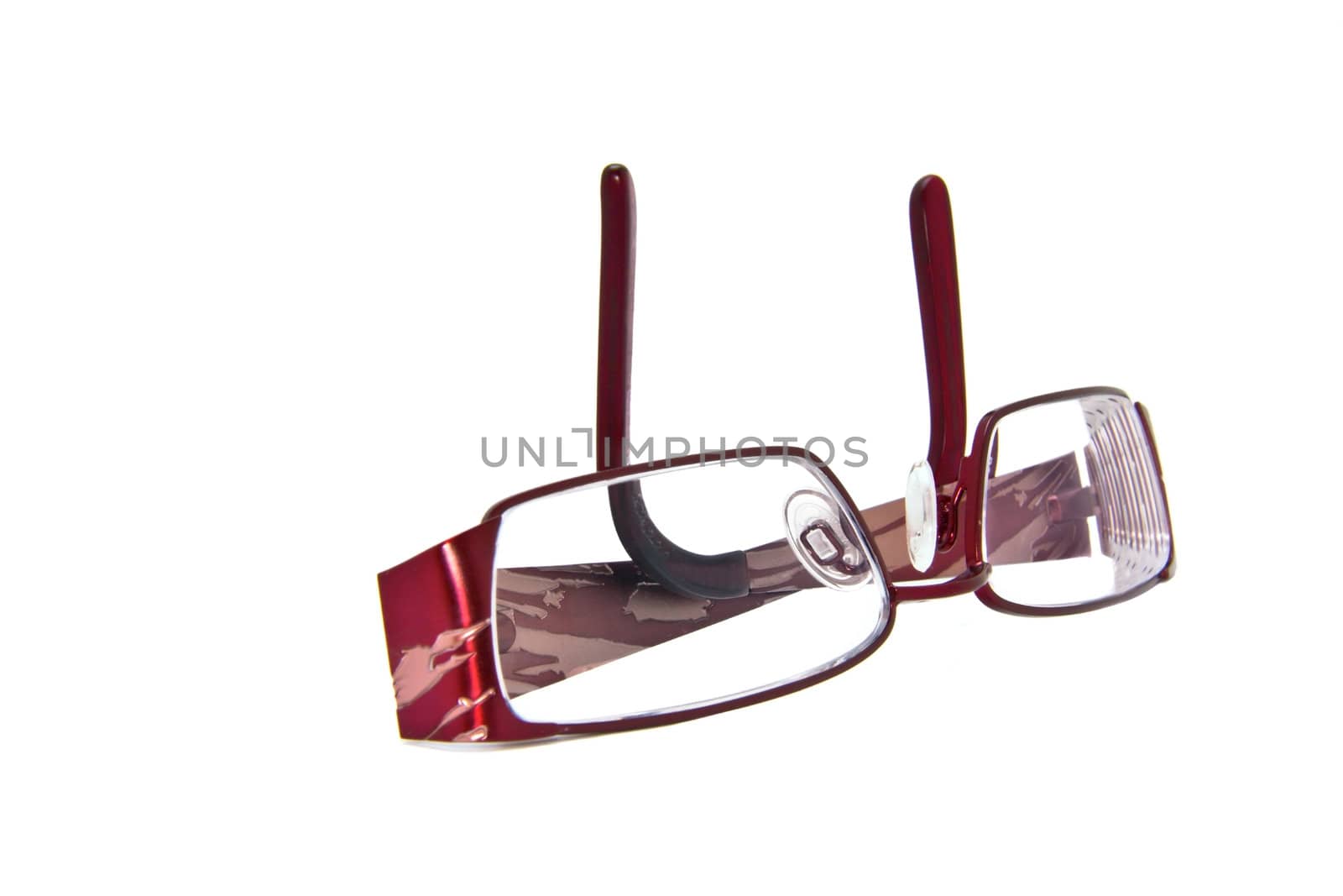 A  pair of  folded eye glasses on a white background