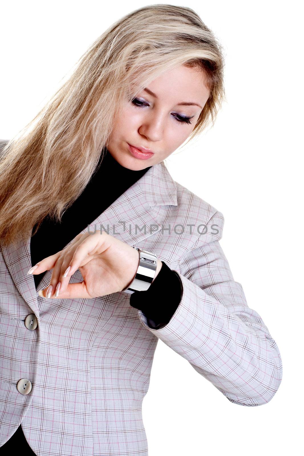 woman looks at the clock on a white background