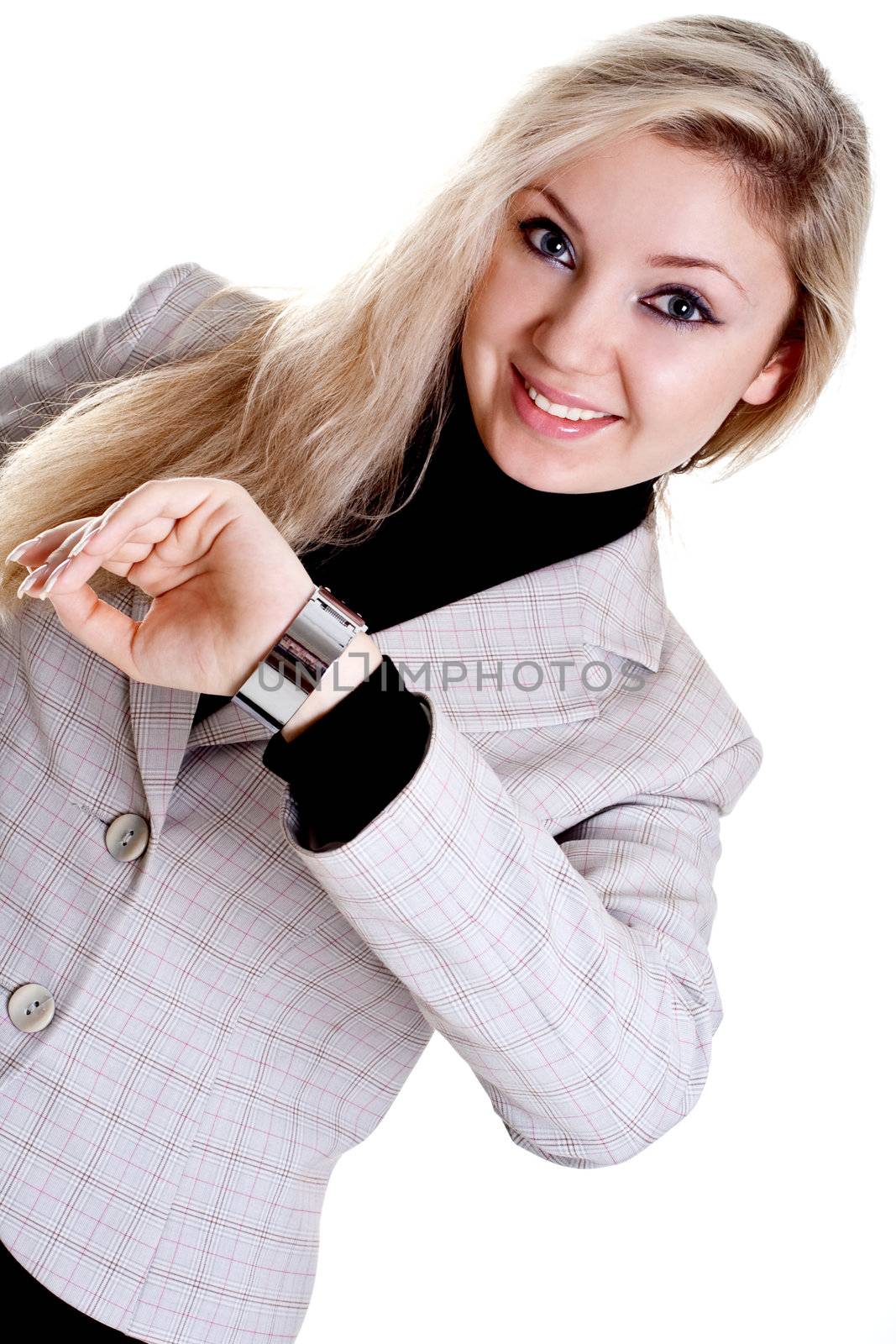 woman looks at the clock on a white background