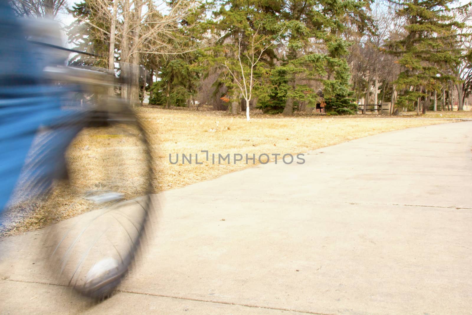 A young boy riding his mountain bike with motion blur