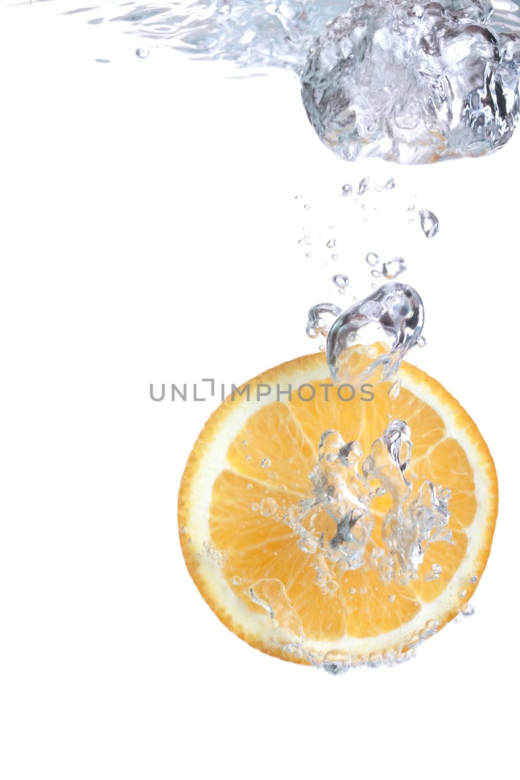 Orange falls into water by Lupen