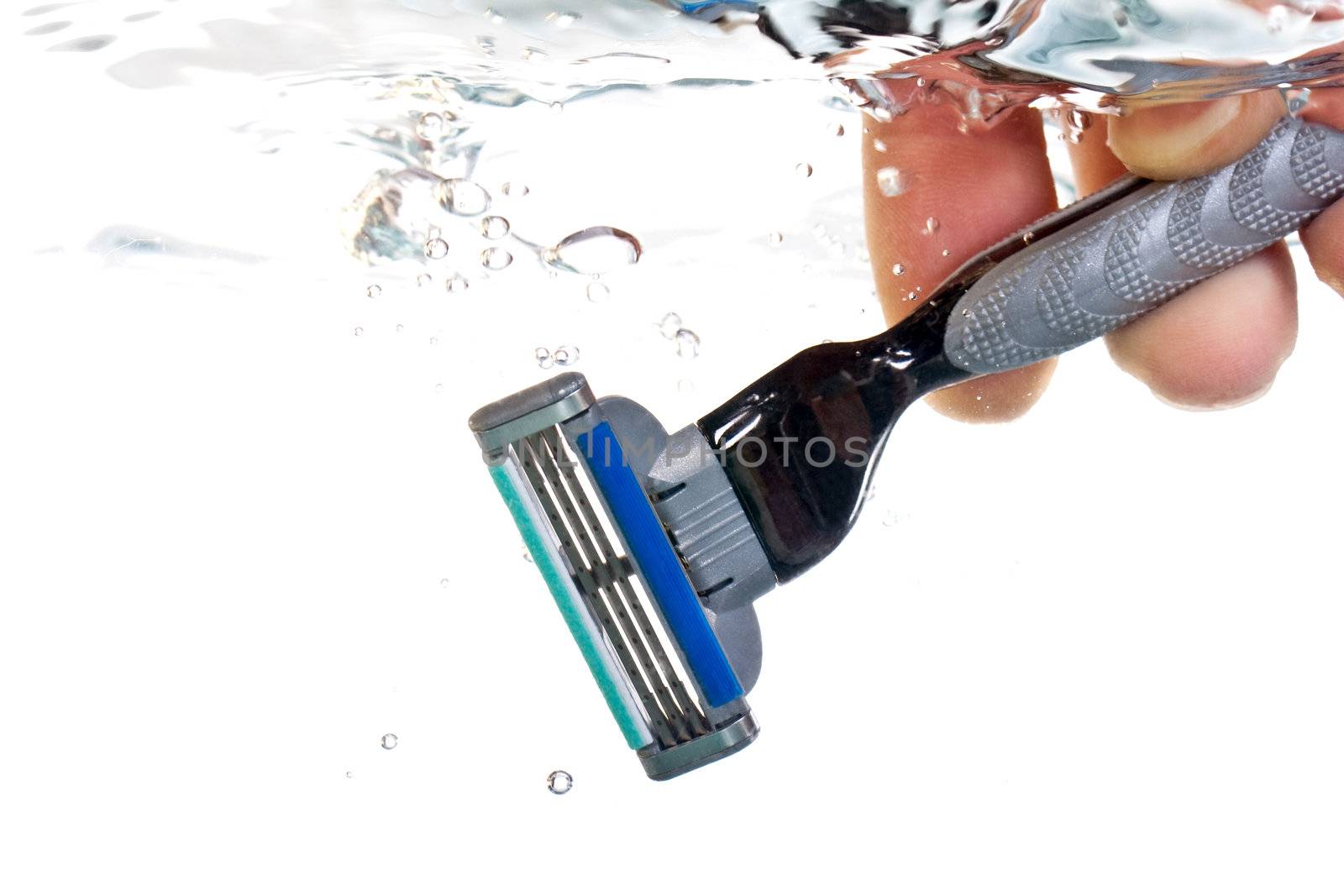 razor in water on a white background