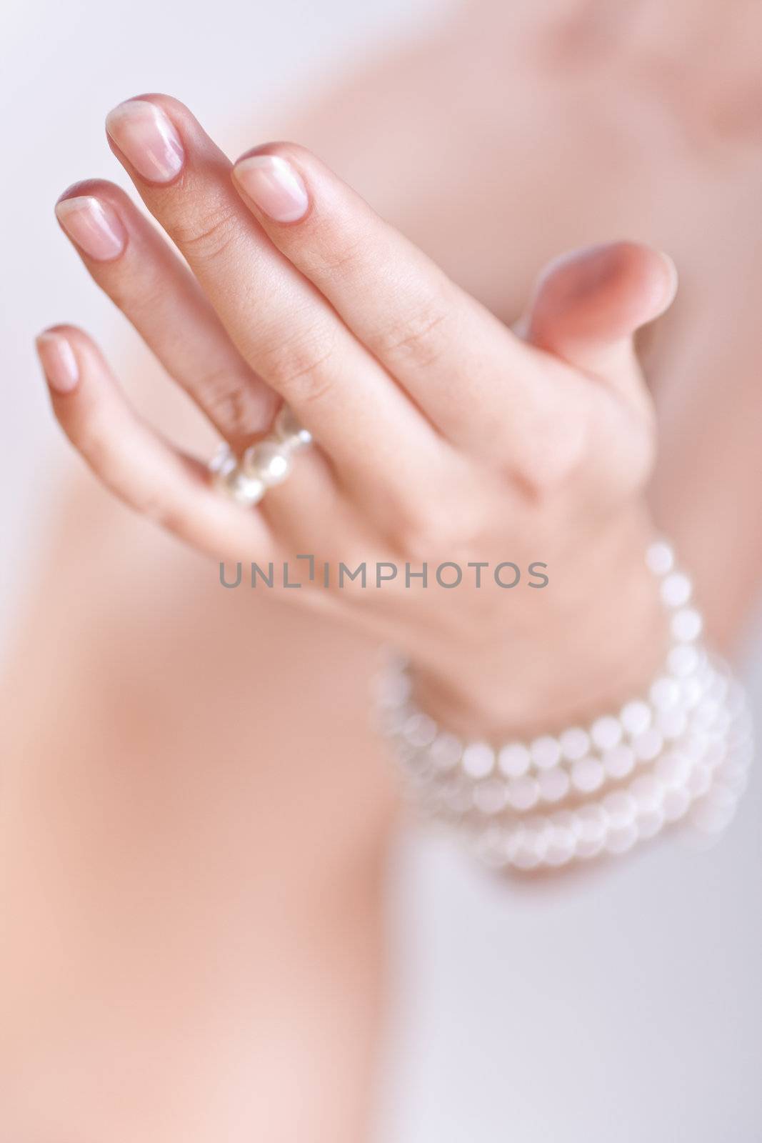 ornament of pearls in the women's hands