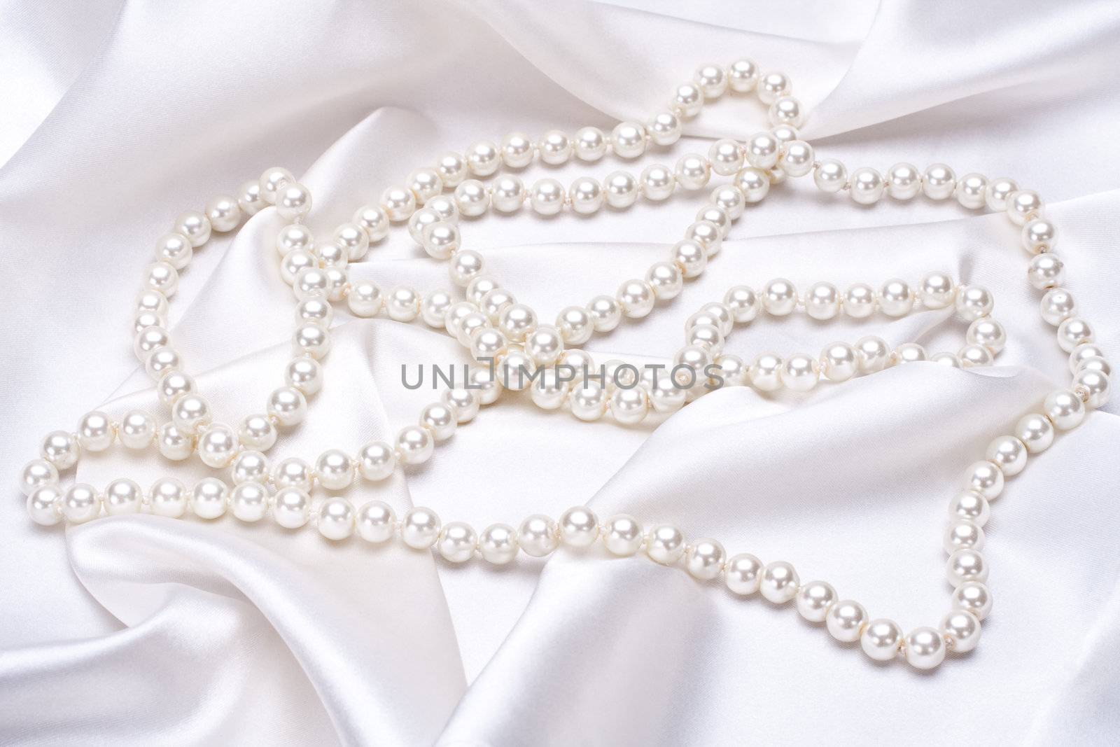 jewels on white satin as a background