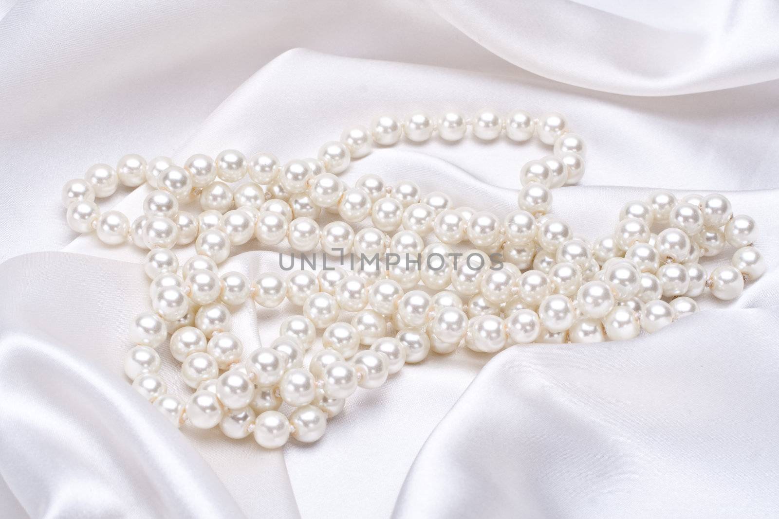 jewels on white satin by Lupen