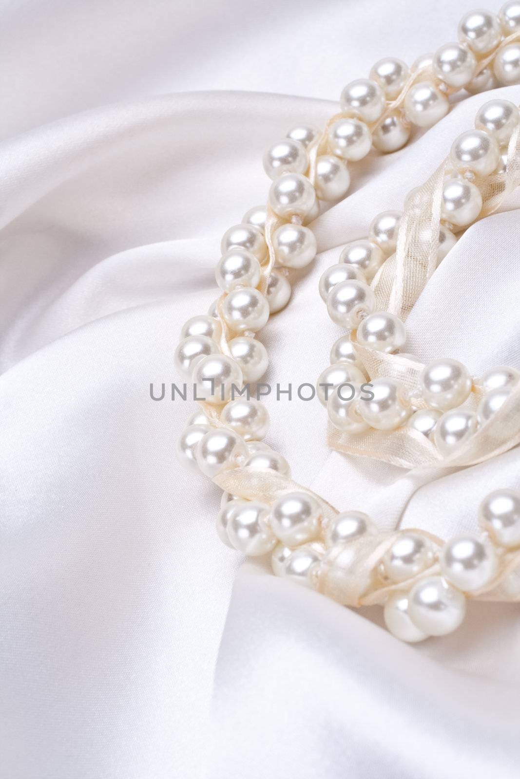 jewels on white satin by Lupen