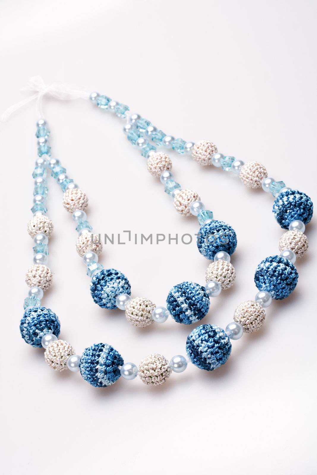 necklace of beads knitted on a white background